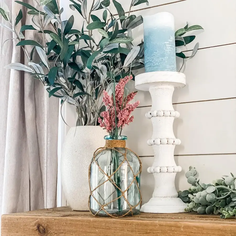 10. Brass Candlesticks on a Sideboard