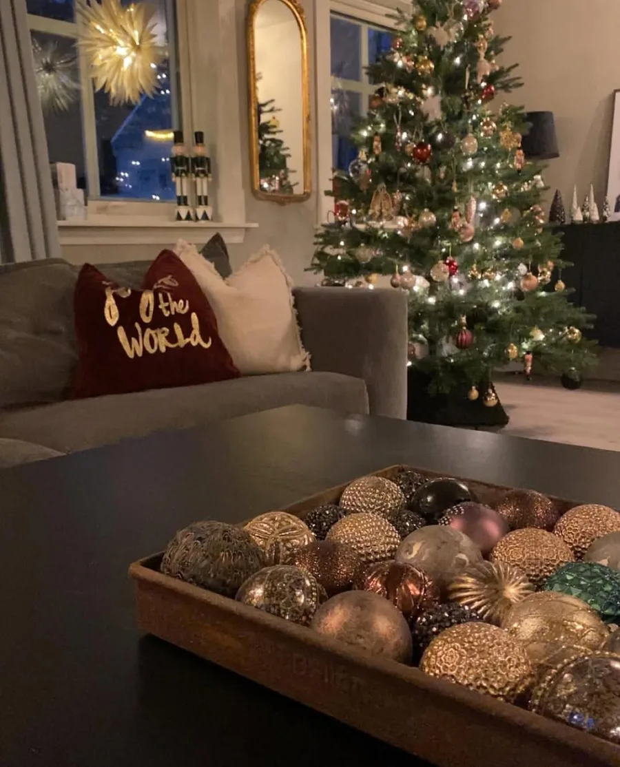 12. Red Berry and Pinecone Bowl on the Coffee Table