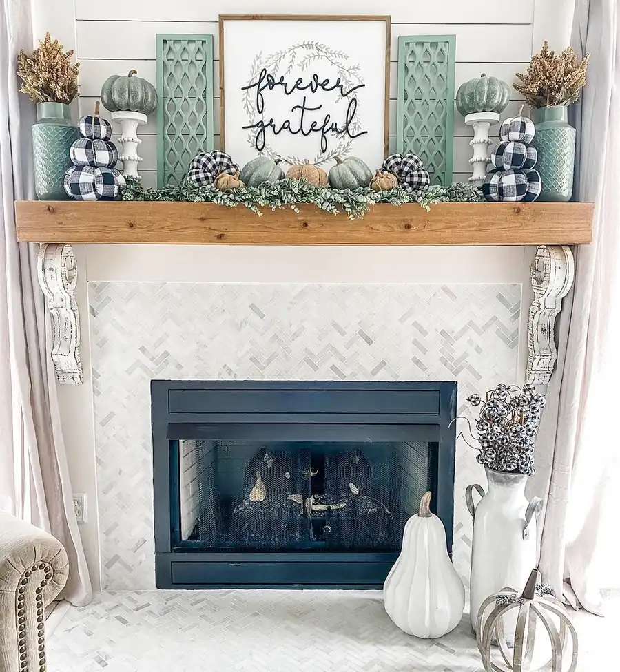 14. Gold-Framed Winter Art Above the Mantel